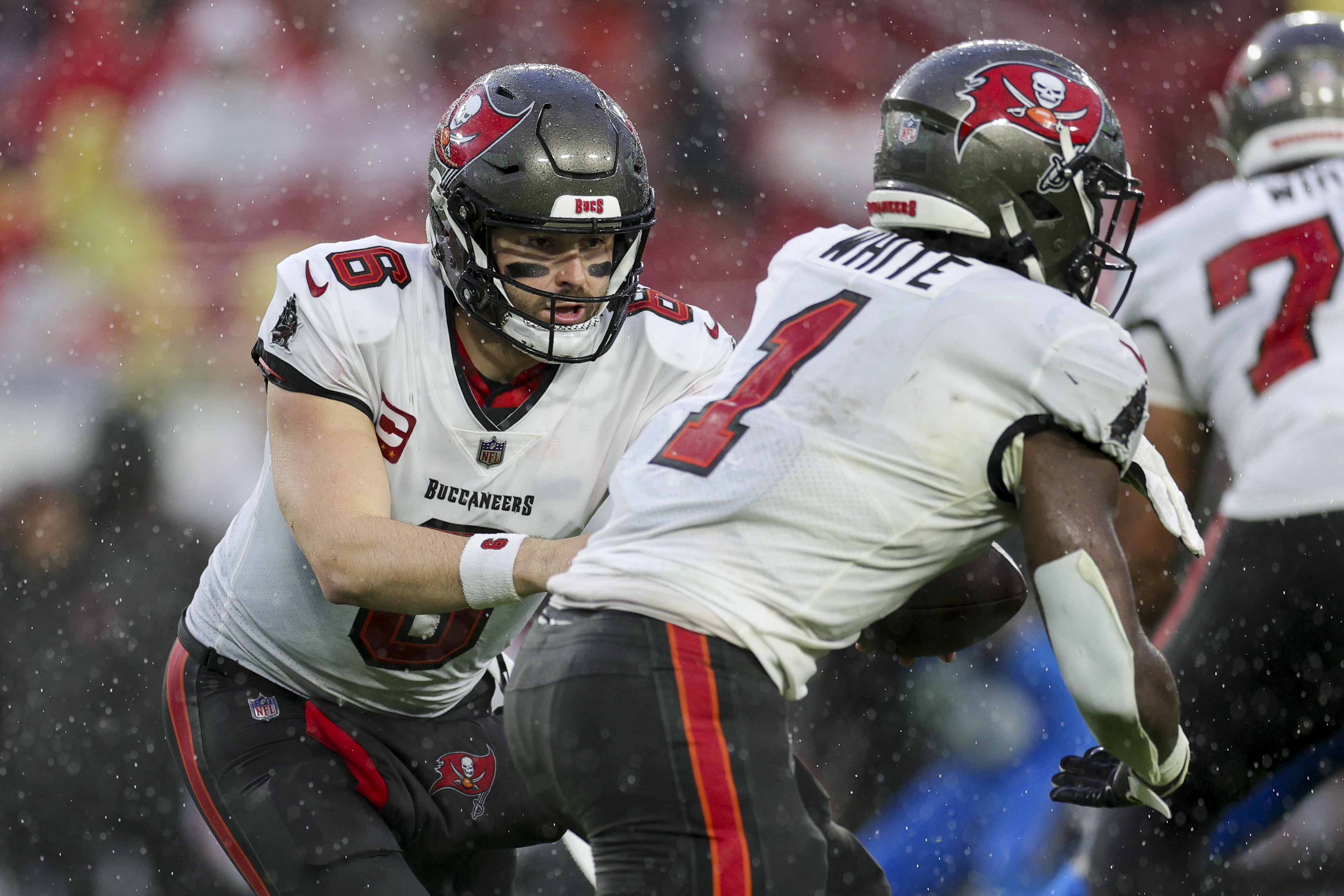 Dec 3, 2023; Tampa, Florida, USA; Tampa Bay Buccaneers quarterback Baker Mayfield (6) hands off to running back Rachaad White (1) against the Carolina Panthers in the second quarter at Raymond James Stadium. Mandatory Credit: Nathan Ray Seebeck-USA TODAY Sports